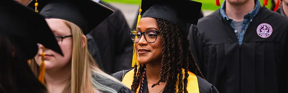 Graduates smiling at commencement