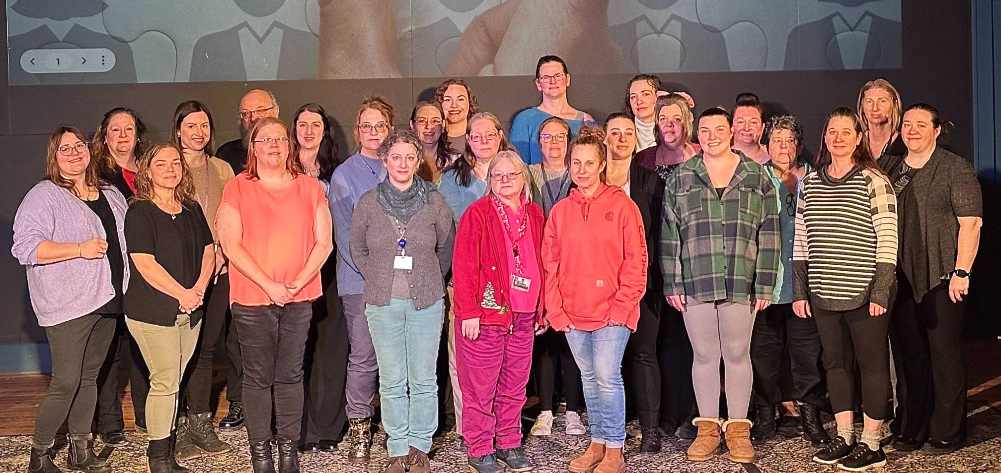 Image of Jefferson County employees standing on stage posing for a photo